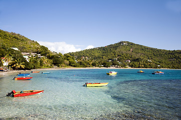 Image showing friendship bay with colorful native fishing boats bequia