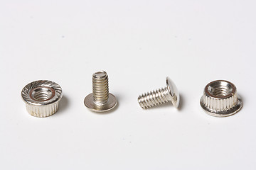 Image showing Many screws and nuts isolated on white background