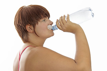 Image showing Young woman with water bottle