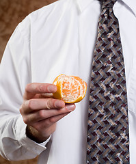 Image showing Businessman Showing Orange