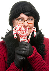 Image showing Pretty Woman Holding Candy Canes