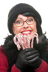 Image showing Pretty Woman Holding Candy Canes