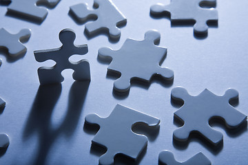 Image showing Jigsaw Pieces with Dramatic Light