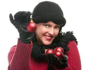 Image showing Attractive Woman Holding Christmas Ornaments