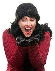 Image showing Excited Woman In Winter Clothes Holds Her Hands Out