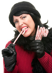 Image showing Pretty Woman Holding Candy Canes