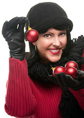 Image showing Attractive Woman Holding Christmas Ornaments