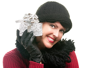 Image showing Pretty Woman Holding Holiday Gift