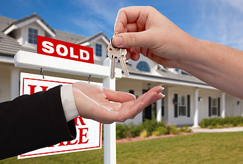 Image showing Handing Over the House Keys in Front of Sold New Home