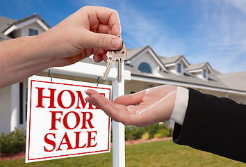 Image showing Handing Over the House Keys in Front of New Home