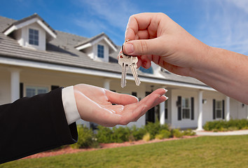 Image showing Handing Over the House Keys in Front of New Home