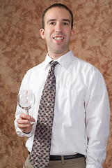 Image showing Business Man Holding Wine Glass