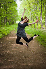 Image showing Joyful Jumping Woman