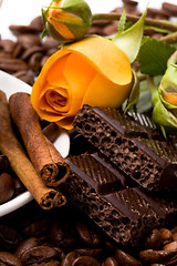 Image showing chocolate, coffee, cinnamon sticks and yellow flower