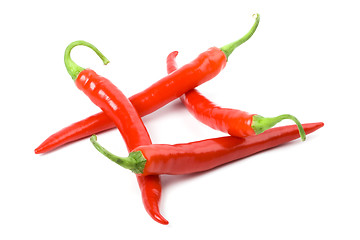 Image showing four red chilly peppers