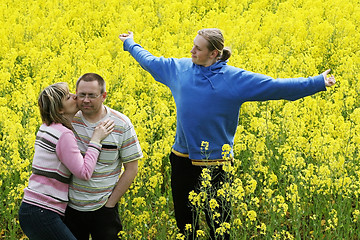 Image showing Three people in meadow
