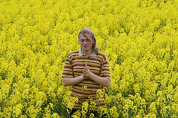 Image showing Men in yellow flowers
