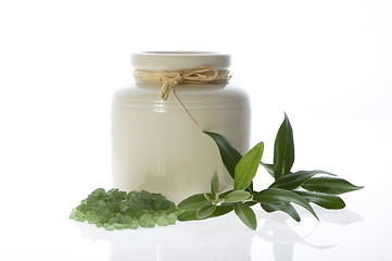 Image showing fresh olive branch and bath salt. spa