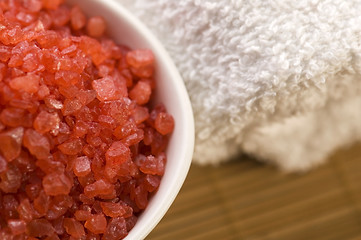 Image showing bath salt and towel. red and white.