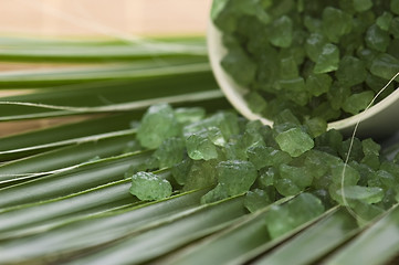 Image showing bath salt and palm leaf