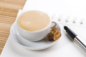 Image showing pen, notebook and cup of coffee