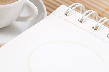 Image showing notebook and cup of coffee