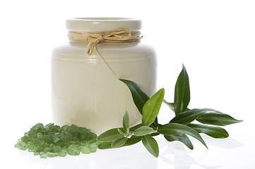 Image showing fresh olive branch and bath salt. spa