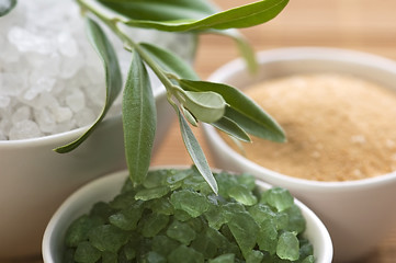 Image showing fresh olive branch and bath salt. spa