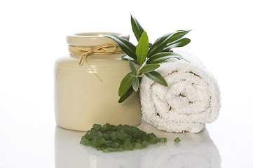 Image showing fresh olive branch and bath salt. spa