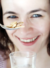 Image showing Young people eating milk with cereals