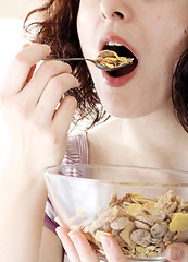 Image showing Young people eating milk with cereals