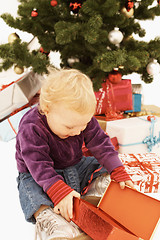 Image showing Wow - Surprised kid opening christmas gifts