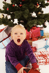 Image showing Christmas - Surprised child opening gifts