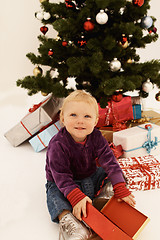 Image showing Christmas - Cute child opening Gifts