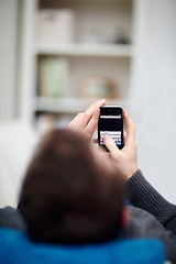 Image showing New Technology - Man  writing sms on cell phone