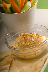 Image showing hummus dip with pita bread and vegetable