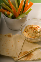 Image showing hummus dip with pita bread and vegetable