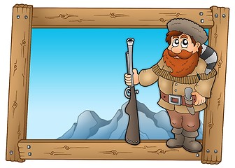 Image showing Cartoon trapper in wooden frame