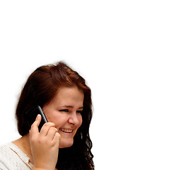 Image showing Happy young woman talking on mobile phone