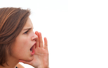 Image showing Young woman screaming at copy space