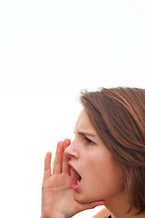 Image showing Young woman screaming at white background