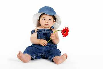 Image showing Child with a Red Daisy