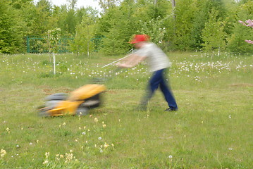 Image showing mowing grass