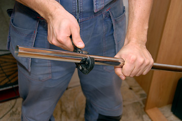 Image showing The hands of a worker