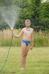 Image showing boy play with water