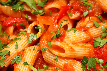 Image showing Penne rigate pasta with tomato sauce. background