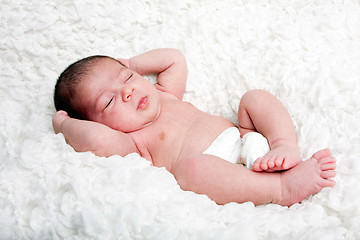 Image showing Cute baby asleep on cloud