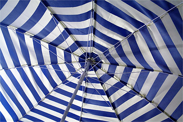 Image showing Striped beach umbrella