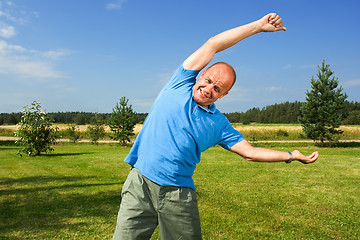 Image showing Middle-aged man streching