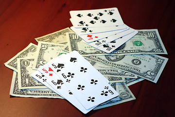 Image showing playing combination in poker and money for rate on table